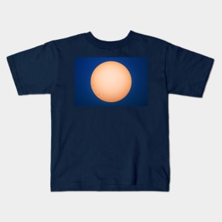 Sun and sunspots angainst blue sky Kids T-Shirt